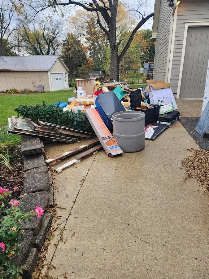 Dumpster being loaded with debris for Commercial Dumpster Rental in Tullahoma